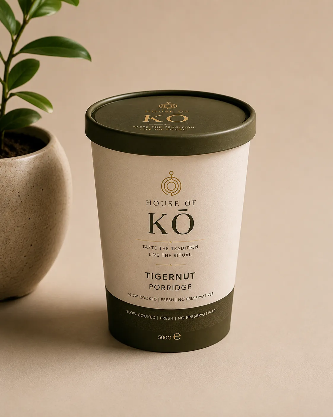 House of KŌ Tigernut Porridge tub in cream and forest green packaging